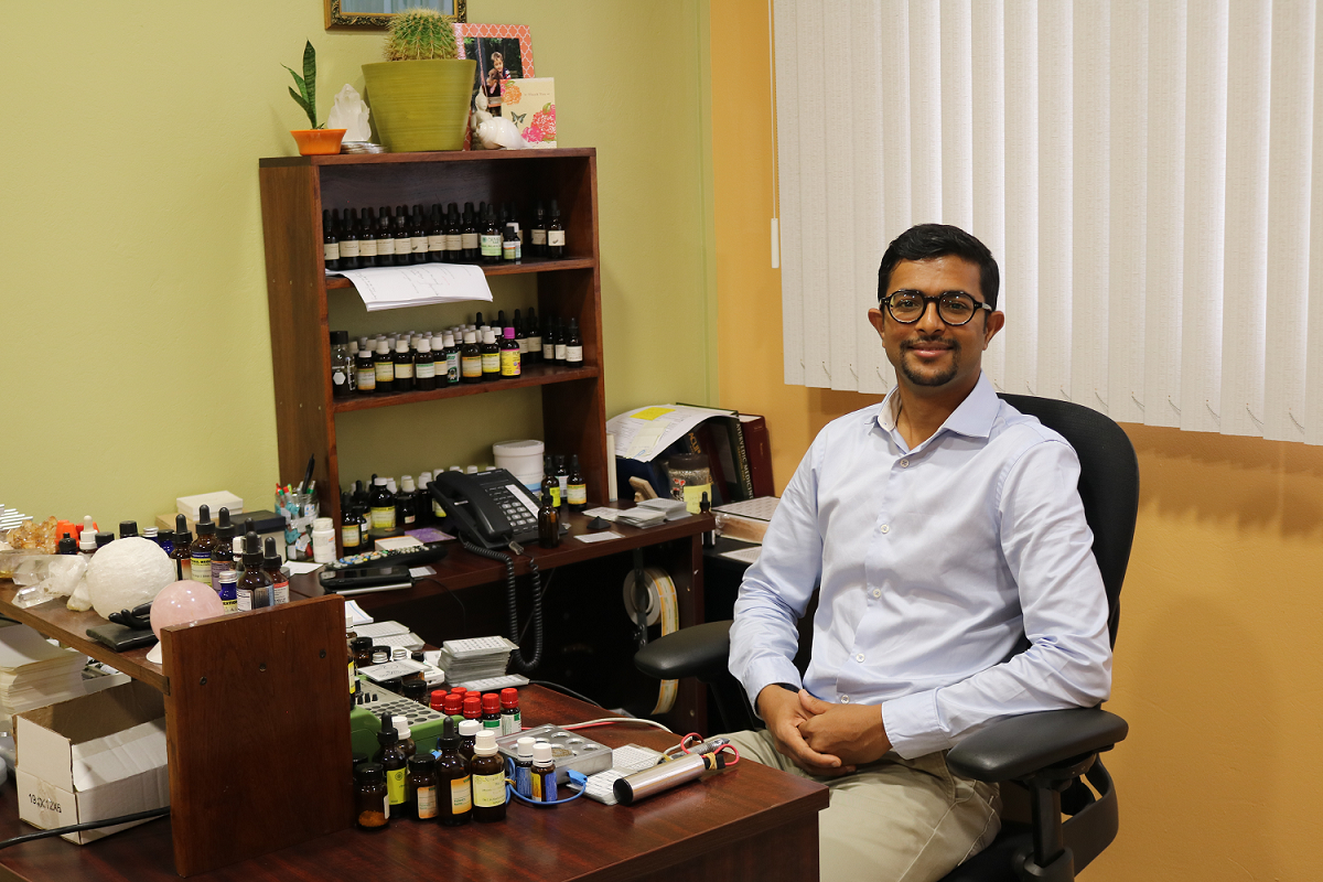 Dr. Nilash at his desk. 